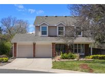 Charming two-story home featuring a two-car garage, landscaped yard, and traditional architectural details at 10200 Julian St, Westminster, CO 80031