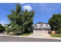 Charming two-story home featuring a three car garage and mature trees at 7636 S Allison Ct, Littleton, CO 80128