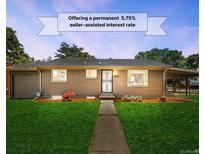 Charming single-story home featuring a lush green lawn, inviting walkway, and seller assisted interest rate at 4300 Osage St, Denver, CO 80211