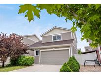 Charming two-story home featuring a spacious two-car garage and well-maintained landscaping at 5536 Kirk St, Denver, CO 80249