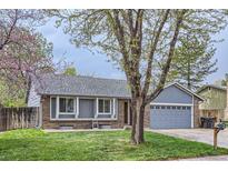 Charming single-Gathering home with a well-manicured lawn and attached two-car garage at 10723 Cherry Ct, Thornton, CO 80233