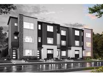 Modern townhomes with striking black and white exteriors and well-maintained landscaping at 451 Interlocken Blvd # 101, Broomfield, CO 80021