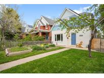 Charming home with a well-maintained lawn and a walkway leading to the front door at 2944 Hooker St, Denver, CO 80211