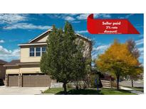 Charming two-story home with a well-manicured lawn and attached two car garage in a desirable neighborhood at 10995 Quintero St, Commerce City, CO 80022