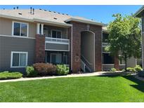 Attractive condominium exterior featuring brick accents, balconies, and well-maintained landscaping at 8481 W Union Ave # 2-204, Littleton, CO 80123