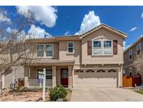 Charming two-story home with a well-manicured lawn and a two-car garage at 3607 Dinosaur St, Castle Rock, CO 80109