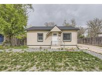 Charming single-story home featuring a well-maintained lawn, neutral-toned exterior, and a welcoming front entrance at 1270 S Tennyson St, Denver, CO 80219