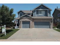 Charming two-story home with brick accents and a spacious three-car garage at 10144 Madison St, Thornton, CO 80229
