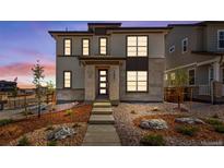 Two-story modern home with landscaped front yard and walkway at 24801 E 33Rd Dr, Aurora, CO 80019