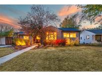 Charming craftsman home with landscaped yard and walkway at 5123 Bryant St, Denver, CO 80221