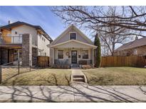 Charming home featuring a cozy front porch and well-maintained lawn, perfect for curb appeal at 4128 N Stuart St, Denver, CO 80212