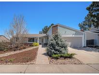 Charming single-Gathering home featuring a landscaped front yard and attached two-car garage at 4570 S Kalispell Way, Aurora, CO 80015
