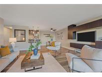 Bright living room with modern decor, sleek furniture, and stylish accents at 955 Eudora St # 203E, Denver, CO 80220