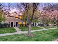 Charming townhomes feature inviting entrances, well-manicured lawns, and mature trees, perfect for comfortable community living at 232 W 5Th Ave, Denver, CO 80204