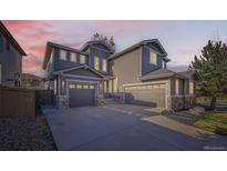 Charming home with two garages and a well-manicured lawn at 10774 Chadsworth Ln, Highlands Ranch, CO 80126