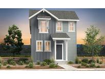 Charming two-story home featuring a gray exterior, white trim, and a well-manicured front yard at 2087 Generations Aly, Brighton, CO 80601