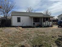 View of the home and backyard, showing the backyard and exterior features of the property at 7080 Cherry St, Commerce City, CO 80022