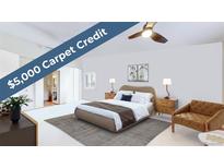 Cozy bedroom featuring a plush bed, stylish furnishings, and a $5,000 carpet credit at 775 S Alton Way # 3D, Denver, CO 80247