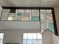 Unique stained glass partition adds character and charm above a bright window at 775 S Alton Way # 3D, Denver, CO 80247