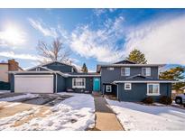 Stunning two-story home with a newly painted exterior and a spacious driveway at 4967 S Urban Ct, Morrison, CO 80465