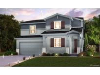 Charming two-story home featuring a well-maintained lawn, neutral colors and inviting curb appeal at 12353 E 101St Pl, Commerce City, CO 80022