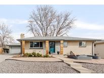 Charming single-story home with well-manicured landscaping and updated exterior features at 6984 Teller Ct, Arvada, CO 80003