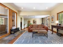 Inviting living room with a wood burning stove and a stylish blue patterned rug at 167 Independence Cir, Breckenridge, CO 80424