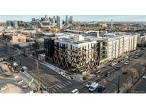 Modern apartment building with unique facade, city skyline, and street view at 2880 Zuni St # 308, Denver, CO 80211