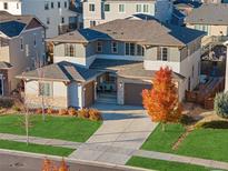 An elevated shot of a home highlighting its architectural design, landscaping, and surrounding neighborhood at 515 Orion Ave, Erie, CO 80516