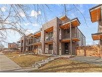 Modern townhomes with brick facade, balconies, and contemporary design elements at 3207 W 25Th Ave, Denver, CO 80211