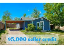Charming blue home with tidy front yard and carport, offering $5,000 seller credit at 2852 W Ellsworth Ave, Denver, CO 80219