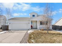 Charming single-Gathering home with a two-car garage, well-maintained lawn, and inviting front porch at 2010 E 125Th Pl, Thornton, CO 80241