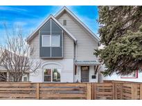 Charming two-story home with modern design elements and a well-maintained front yard at 3339 Tejon St, Denver, CO 80211