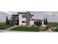 Stunning modern home with clean lines, mixed materials, and a well-maintained lawn at 5052 Nile Ct, Golden, CO 80403
