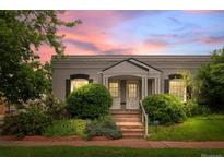 Charming home with well-maintained landscaping and a cozy entrance, evoking a sense of warmth and curb appeal at 1038 E 4Th Ave, Denver, CO 80218