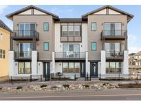 Modern townhomes with balconies, sleek lines, and inviting front patios create an appealing curb presence at 3109 W Bates Ave, Denver, CO 80236