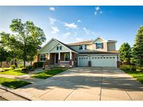 Charming two-story home with a three car garage and a well-manicured front yard at 2861 Eagle Cir, Erie, CO 80516