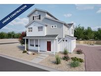 Charming two-story home with a red front door and a beautifully landscaped yard at 46545 Sunflower Ln, Bennett, CO 80102