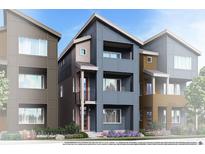 Modern townhome showcasing vertical elements, stylish color blocking and private balconies at 1593 W 166Th Ave, Broomfield, CO 80023