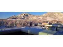 Stunning aerial view of a luxury condo with mountain backdrop at 1077 Canyon Blvd # 403, Boulder, CO 80302