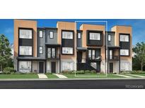 Modern townhome featuring a two-tone exterior with a private balcony and well-maintained landscaping at 815 Josephine Way, Superior, CO 80027