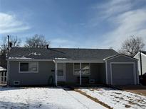 Charming single-story home with a well-maintained front yard and attached garage at 3323 S Glencoe St, Denver, CO 80222