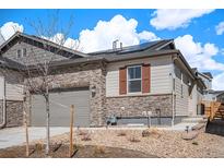 Charming single-Gathering home featuring stone accents, a two-car garage, and a well-maintained landscape at 3522 N Buchanan Way, Aurora, CO 80019