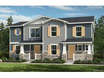 Charming two-story home featuring stylish siding, stone accents, a welcoming porch, and a well-maintained lawn at 20720 E 58Th Ave, Aurora, CO 80019