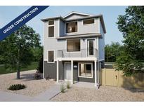 Two-story home featuring modern design, large windows, and balcony, under construction at 46559 Avery Ln, Bennett, CO 80102