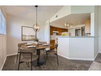 Dining area featuring modern light fixture, room to entertain and open floorplan at 5705 N Genoa Way # 308, Aurora, CO 80019