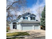 Charming two-story home with a three-car garage and well-maintained front yard at 10765 Fremont Dr, Parker, CO 80134