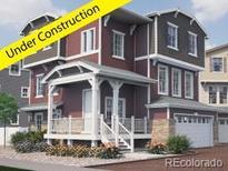 Under construction, this craftsman-style home boasts a charming front porch and a two-car garage at 1218 Sugarloaf Ln, Erie, CO 80516