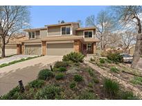 Charming two-story home with a well-maintained lawn and inviting curb appeal at 1571 S Trenton Ct, Denver, CO 80231