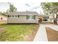 Cozy one-story home featuring a covered carport and newly landscaped front yard at 2696 S Grove St, Denver, CO 80219